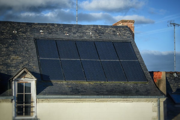 house with solar panel attached