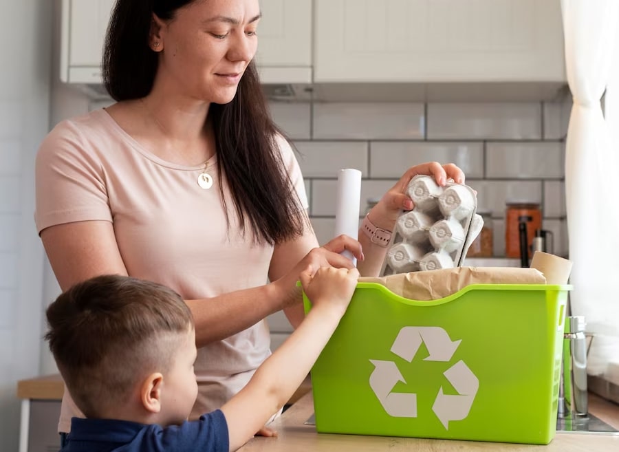 mom showing her son on how to recycle used things