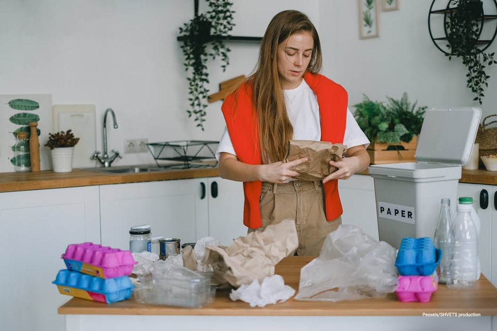 Woman sorting trash