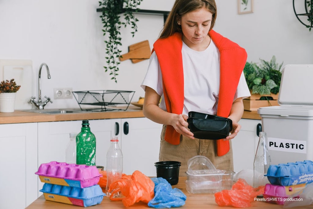 woman segregating trash