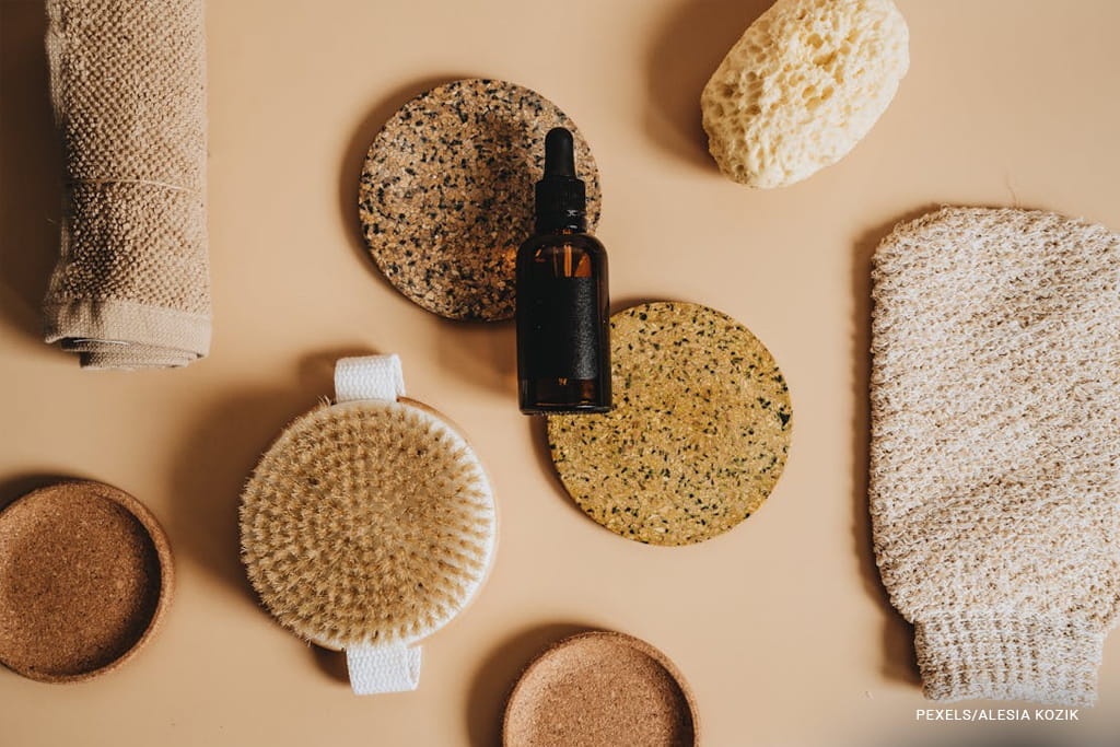 make up brush and essential oil bottle