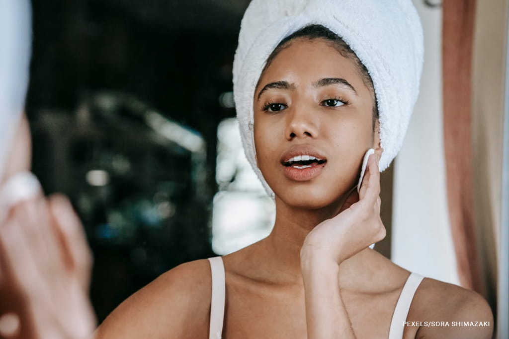 woman cleaning face