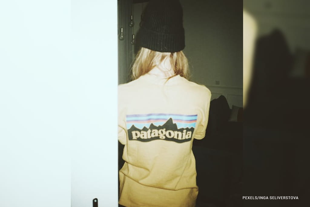 woman wearing bonnet hat and t-shirt with patagonia brand printed